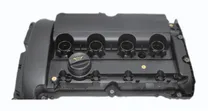 MONTTRON valve cover: a black plastic cam cover for a four-cylinder engine, with the four spark plug wells, the oil filler cap and the breather connection